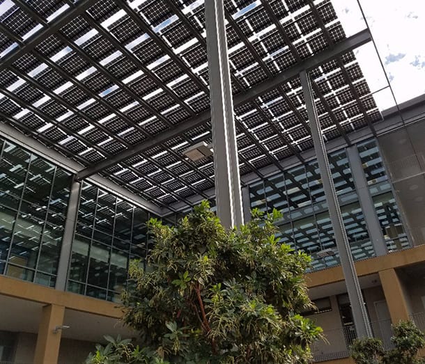 Bottom view of solar installation on a commercial building.